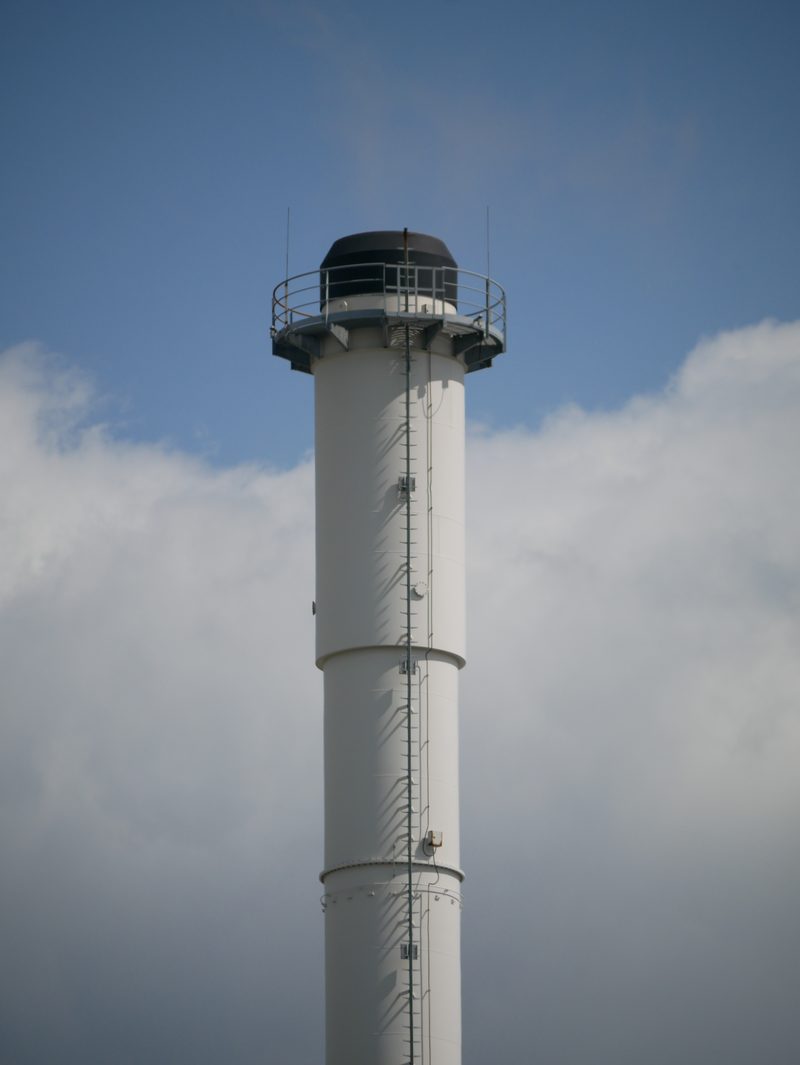 White observation tower against the sky