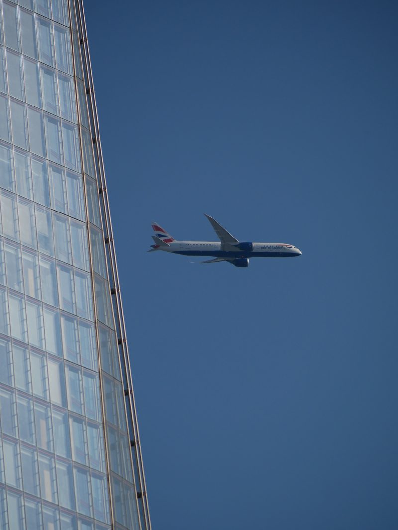 The Shard with a passing plane
