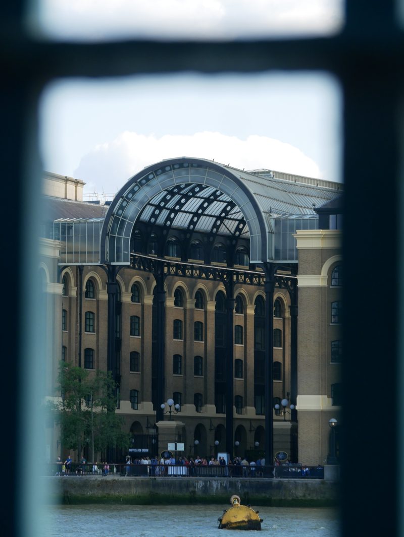 Domed building framed through a window